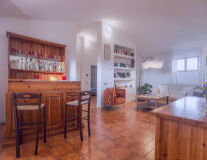 a kitchen with wooden cabinets and a wood floor